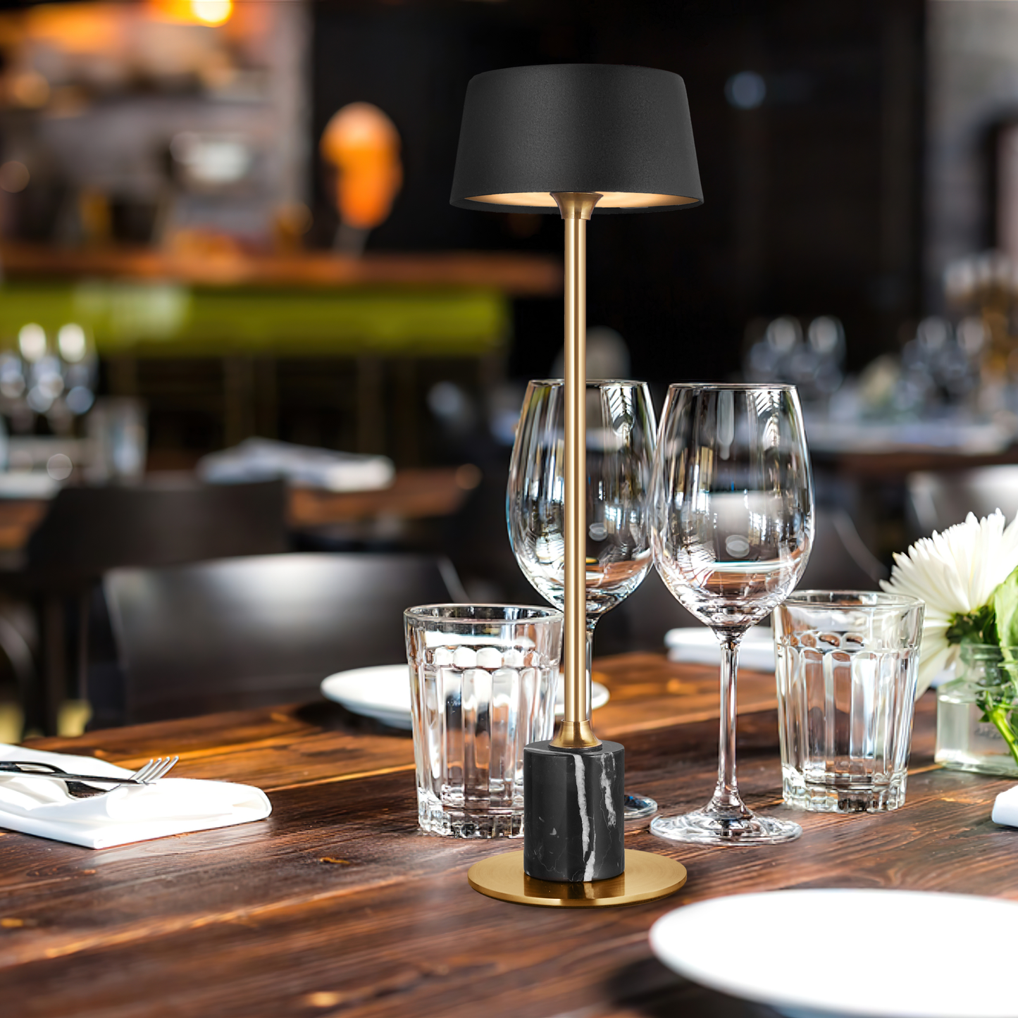 cartina ambient lamp's Sleek design complements an elegant dinner table, offering soft, warm lighting,