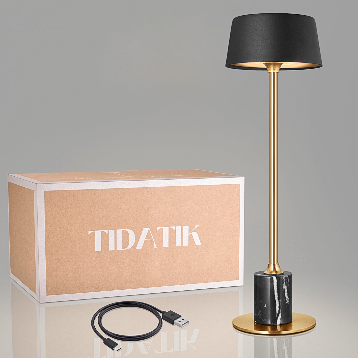 Black Tidatik cordless ambient table light offers 42 hours of warm, rechargeable light with a dimmer, perfect for cozy settings in restaurants, resorts, and bars.