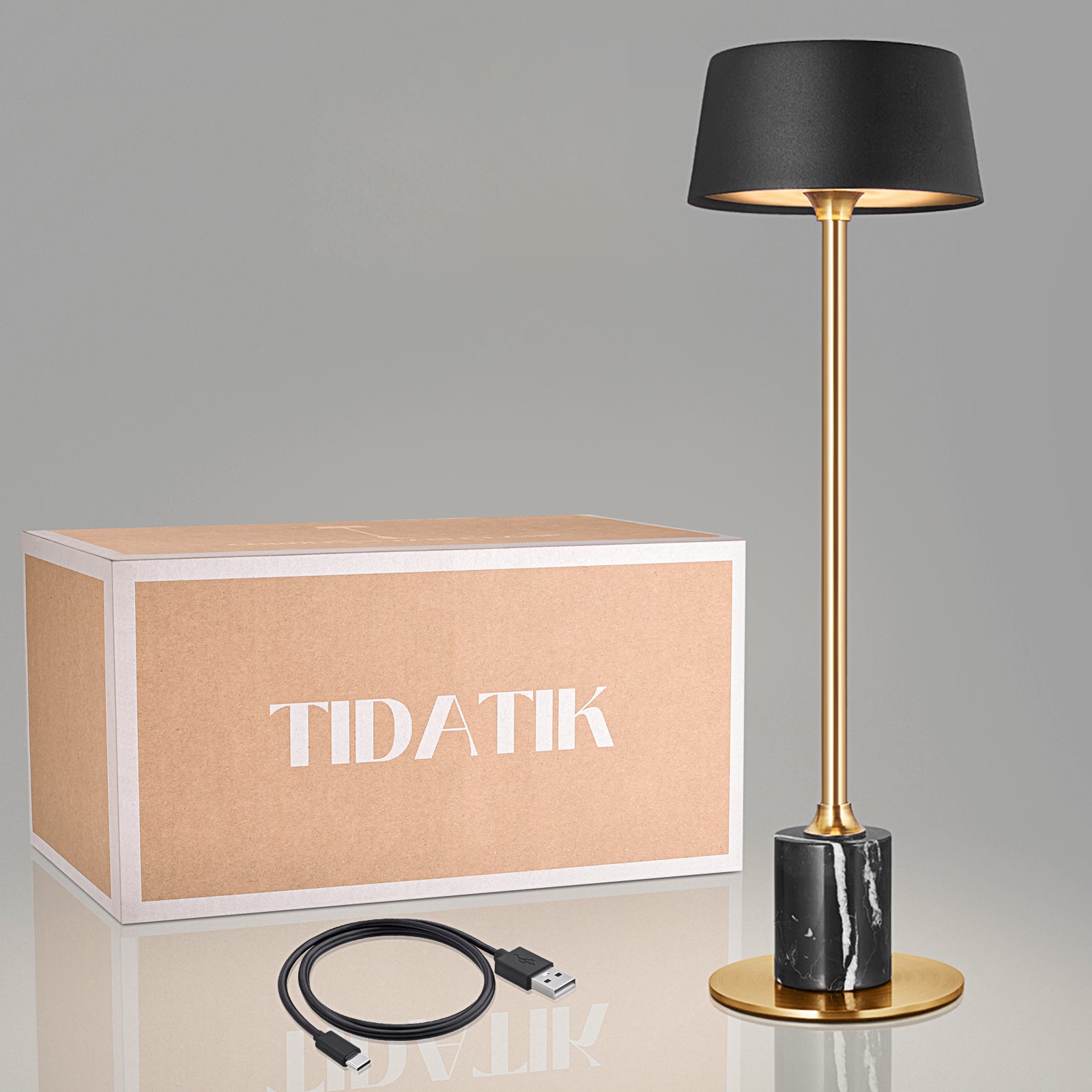 Black Tidatik cordless ambient table light offers 42 hours of warm, rechargeable light with a dimmer, perfect for cozy settings in restaurants, resorts, and bars.